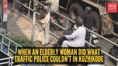 An elderly woman in Kozhikode bravely confronted a scooter rider attempting to use the footpath to bypass traffic. Standing firm, she asserted the pavement is for pedestrians, not vehicles. Her courageous stand, captured on video, has garnered widespread admiration online, highlighting the importance of respecting public spaces and pedestrian safety. Watch: Elderly woman blocks scooter on footpath, internet can’t stop cheering