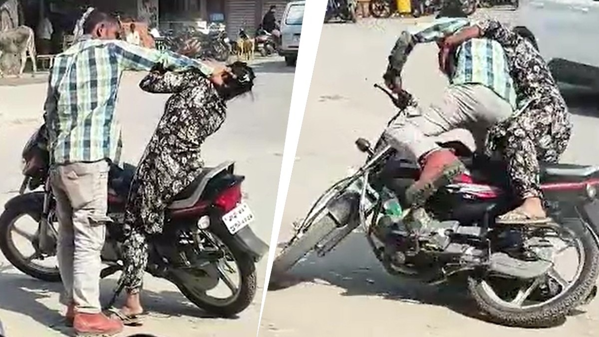 बीच सड़क पति-पत्नी का हाईवोल्टेज ड्रामा (Photo: Screengrab) बीच सड़क पति-पत्नी का हाईवोल्टेज ड्रामा (Photo: Screengrab)