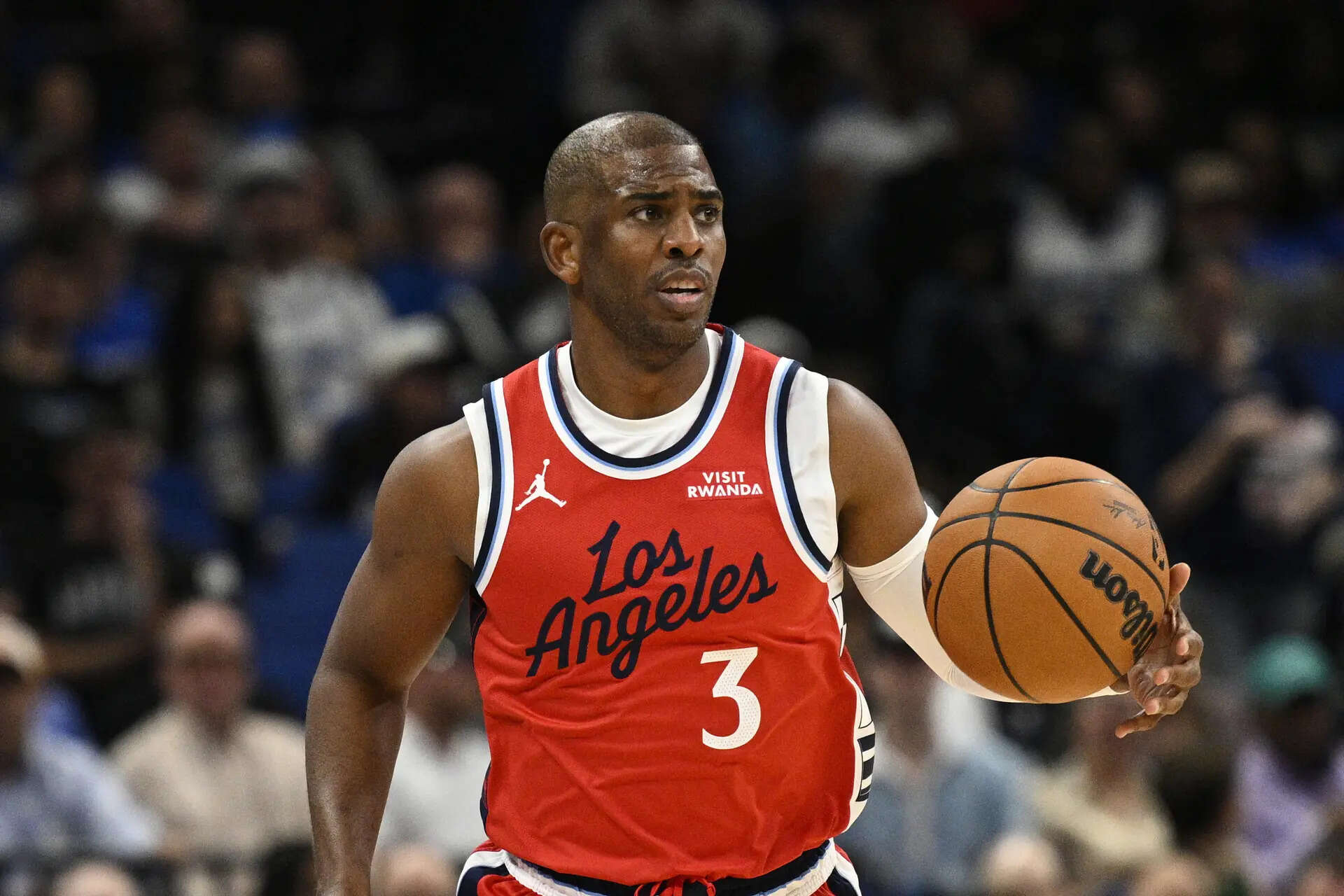 FILE - Los Angeles Clippers guard Chris Paul (3) brings the ball up the court during the first half of an NBA basketball game against the Orlando Magic, Nov. 20, 2025, in Orlando, Fla. (AP Photo/Phelan M. Ebenhack, File) Chris Paul, the 'Point God,' retires as NBA's All-Star weekend begins, ending a 21-season NBA run