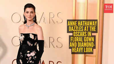 Anne Hathaway owns the Oscars 2026 red carpet in a stunning floral mermaid gown