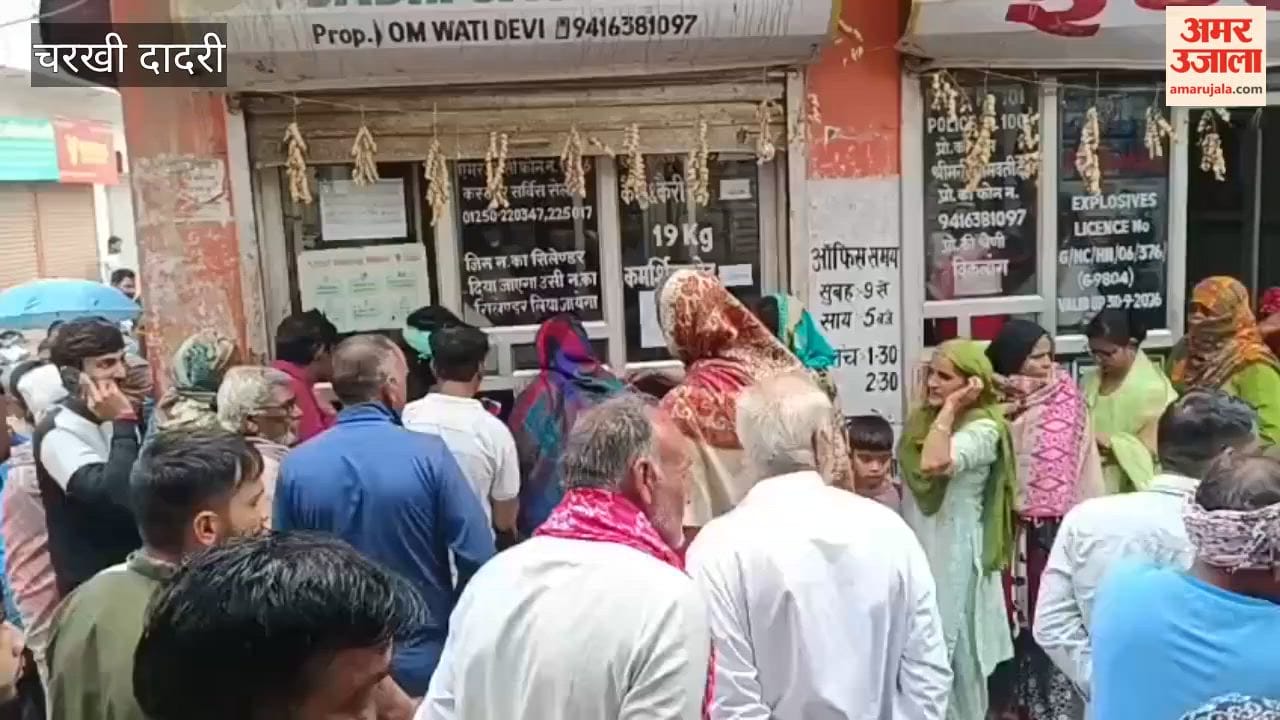 Consumers in Charkhi Dadri continued to stand in queues for cylinders, even amidst rain