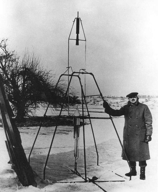 Robert Goddard, on March 16, 1926, holds the launching frame of his most notable invention—the first liquid-fueled rocket.Photo: Wikimedia Commons